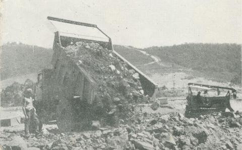 Dumping rock fill on the dam seat, Upper Yarra Dam, 1954