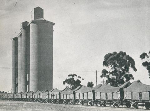 Wheat train passing the silos at Donald, 1955