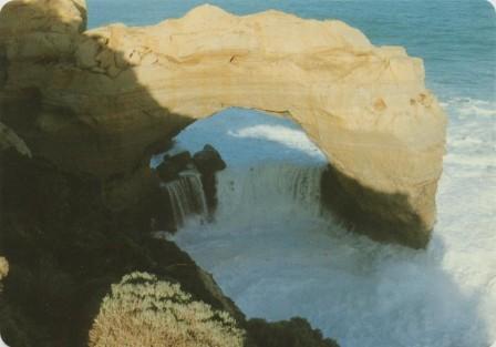 White water racing through The Arch west of Port Campbell