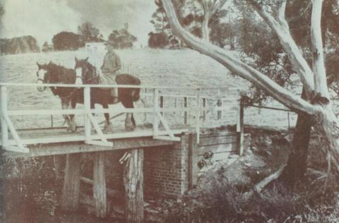 Man on horseback crossing wooden bridge, Bayswater, 1947