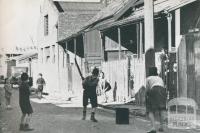 The childrens playground, a slum street, Richmond, 1942