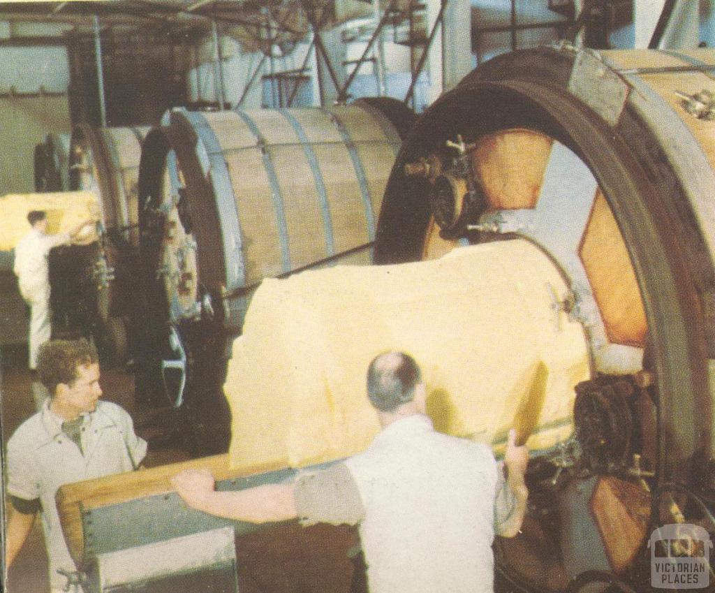 Taking butter from the churns at the Korumburra factory, c1952