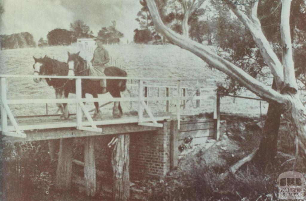 Man on horseback crossing wooden bridge, Bayswater, 1947