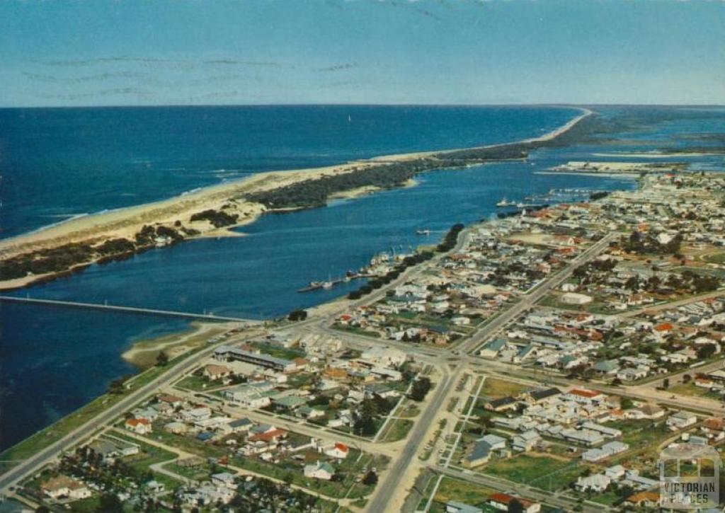 Aerial view of Lakes Entrance Township and Ninety Mile Beach, 1974